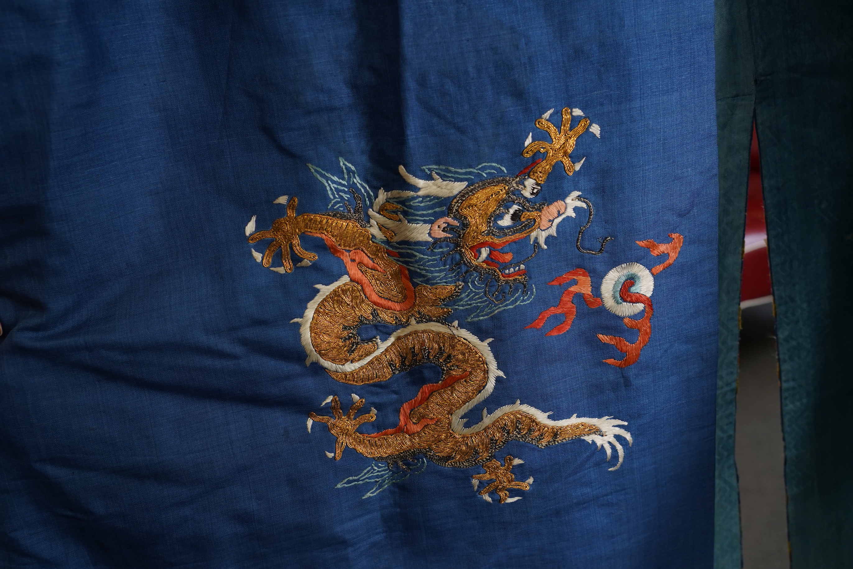 A Chinese blue silk man’s dragon robe, jifu, 19th century
